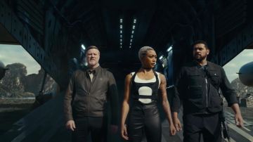 Satin black pants worn by Braddock (Tati Gabrielle) as seen in Uncharted Movie