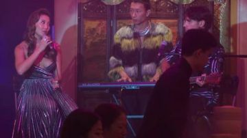 The black and silver dress worn by Mindy Chen (Ashley Park) in the series Emily in Paris (Season 2 Episode 10)