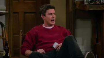 Red crewneck sweater worn by Jesse (Chris Lowell) as seen in How I Met Your Father TV series outfits (Season 1 Episode 3)
