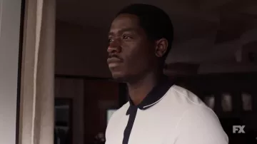 White polo shirt worn by Franklin Saint (Damson Idris) as seen in Snowfall TV series outfits (Season 5)