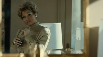 Goldy Turtleneck sweater worn by Tammy Faye Bakker (Jessica Chastain) as seen in The Eyes of Tammy Faye outfits