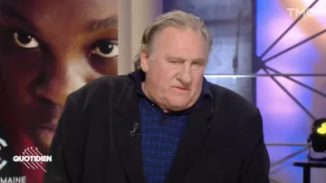The blue plaid polo shirt worn by Gérard Depardieu in the Daily show of Tuesday, February 15, 2022