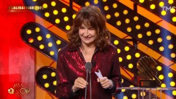 The shiny red jacket zipped worn by Valérie Lemercier in Q in the show Daily, Les Q D'or February 16, 2022