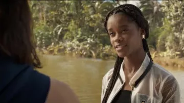 The transparent white jacket gradient black with pockets of Shuri (Letitia Wright) in the movie Black Panther