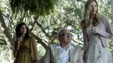 Yellow printed dress worn by Eve­lyn Cow­an (Jade Fernandez) as seen in Deep Water movie outfits