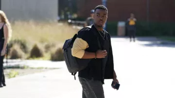 Black backpack worn by Spencer James (Daniel Ezra) as seen in All American TV series outfits (Season 4 Episode 11)