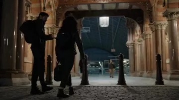Black backpack worn by Eve Polastri (Sandra Oh) as seen in Killing Eve TV series outfits (S04E02)
