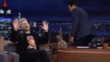 Black Printed T-shirt worn by Jon Glaser as seen in The Tonight Show Starring Jimmy Fallon on March 14, 2022