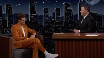 White Sneakers with orange details worn by Andrew Garfield as seen in Jimmy Kimmel Live! on March 16, 2022