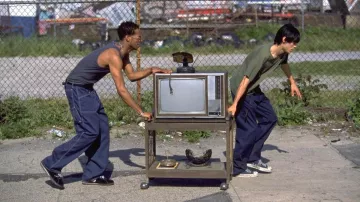 Dark blue baggy jeans worn by Tyrone C. Love (Marlon Wayans) in Requiem for a Dream movie outfits