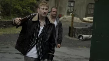 Leather jacket with fur collar worn by Dympna (Barry Keoghan) as seen in Calm with Horses movie outfits