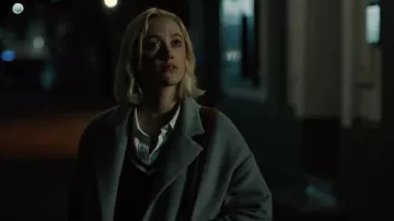 Long coat worn by Julia (Maika Monroe) as seen in Watcher movie outfits