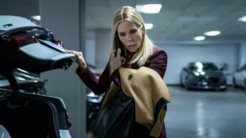 Black Leather Handbag worn by Dot Karlson (Cheryl Hines) as seen in The Flight Attendant TV series (Season 2 Episode 6)