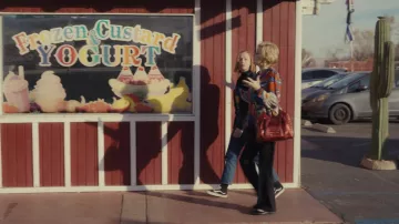 Red handbag worn by Deborah Vance (Jean Smart) as seen in Hacks TV series wardrobe (Season 2 Episode 2)