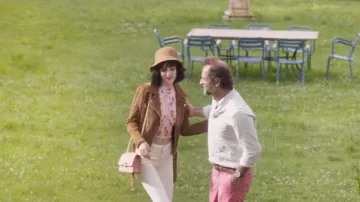 The pink handbag worn by Christine (Claire Chust) in the movie Champagne!