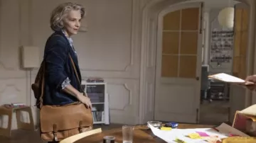 Leather Messenger Bag worn by Sophie Brunet (Juliette Binoche) as seen in The Staircase (S01E05)