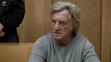 The fine grey sweater worn by Simon (François Cluzet) in the film Masquerade