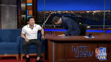 White polo shirt worn by Simu Liu as seen in The Late Show with Stephen Colbert on June 9, 2022