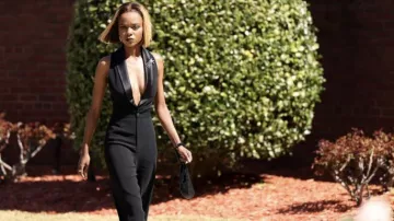 Black sleeveless tuxedo jumpsuit worn by Zenzi Fullington (Ashleigh Murray) as seen in Tom Swift (S01E05)