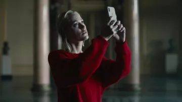 Red sweater worn by Julia (Maika Monroe) as seen in Watcher movie outfits