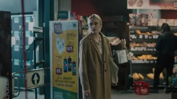 Camel coat worn by Julia (Maika Monroe) as seen in Watcher