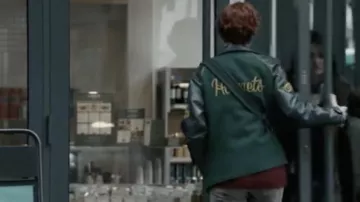 The dark green Hornets leather and suede jacket worn by Fleur Arnaud (Cécile de France) in the movie Superstar