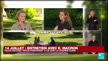 The long black dress worn by Anne-Claire Coudray during the Interview of Emmanuel Macron on July 14, 2022