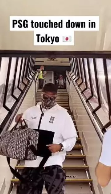 Kylian Mbappé Kylian Kylian's Nike zipped white hooded jacket upon arrival at Tokyo Airport