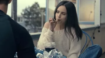 Cream knit off the shoulder sweater worn by Cassie (Sofia Carson) in Purple Hearts movie outfits