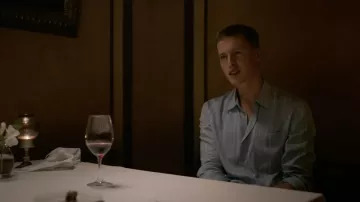Blue long sleeve shirt with white Stripes worn by Carl (Harris Dickinson) in Triangle of Sadness