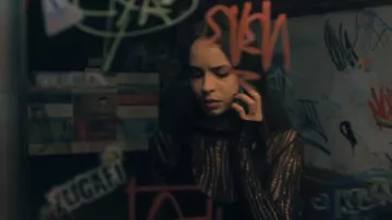 Black T-shirt with holes by Cassie (Sofia Carson) in Badly Wounded Hearts movie