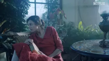 Red dress worn by Lady Constance Chatterley (Emma Corrin) as seen in Lady Chatterley's Lover movie