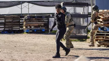 Black boots worn by Special Agent Tiffany Wallace (Katherine Renee Kane) in FBI TV series (Season 5 Episode 8)