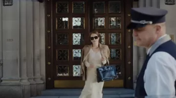 Black leather handbag worn by Madeline (Julianne Moore) as seen in Sharper