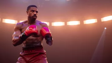 Red boxing gloves worn by Adonis Creed (Michael B. Jordan) as seen in Creed III movie