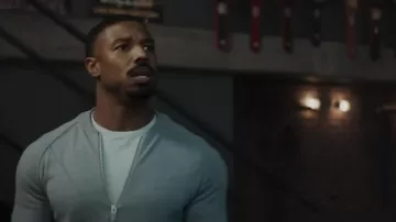 Grey zip sweater worn by Adonis Creed (Michael B. Jordan) as seen in Creed III movie wardrobe
