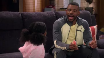 Puma grey and yellow tracksuit worn by Bernard (Jermelle Simon) as seen in The Upshaws (S03E04)