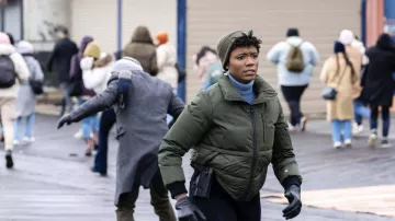 Olive green down jacket worn by Special Agent Tiffany Wallace (Katherine Renee Kane) in FBI (S05E15)