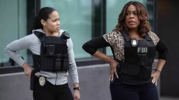 Leopard printed top worn by Simone Clark (Niecy Nash) as seen in The Rookie: Feds (S01E18)