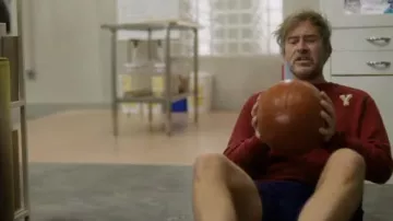 Yale red sweater worn by Billy (Mark Duplass) as seen in Biosphere movie outfits