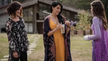 Yellow silk dress worn by Lottie (Simone Kessell) as seen in Yellowjackets TV show (Season 2 Episode 2)