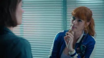 The blue and white satin jacket worn by Morgane Alvaro (Audrey Fleurot) in the HPI series: High Intellectual Potential (S01E08)