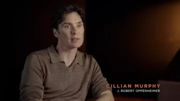 Brown polo shirt worn by Cillian Murphy in Oppenheimer | Pushing The Button Featurette YouTube video