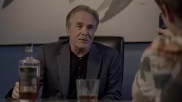 Black polo shirt worn by Liam (Don Johnson) as seen in The Collective movie