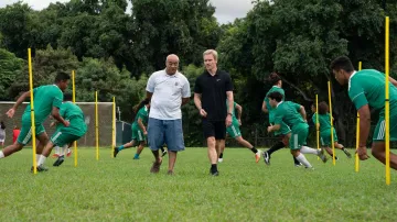Striped polo shirt worn by Tavita (Oscar Kightley) as seen in Next Goal Wins