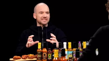 Zip sweater worn by Sean Evans as seen in Hot Ones