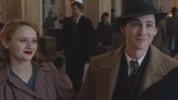 Camel wool coat worn by Addy Kurc (Logan Lerman) as seen in We Were the Lucky Ones (Season 1)