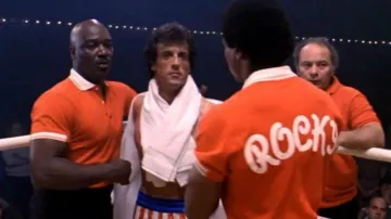 The "Rocky" team coach's polo shirt worn by Apollo Creed (Carl Weathers), in Rocky III: Eye of the Tiger