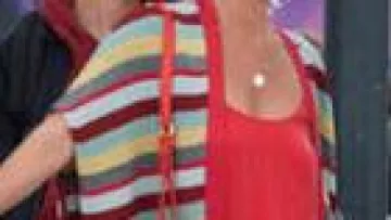 Carole's (Mathilde Seigner) colourful long cardigan in Ibiza