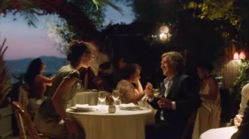 Looks from the movie Masquerade: Margot Hansen (Marine Vacth) wears a green satin or silk dress during her dinner with Simon (François Cluzet)